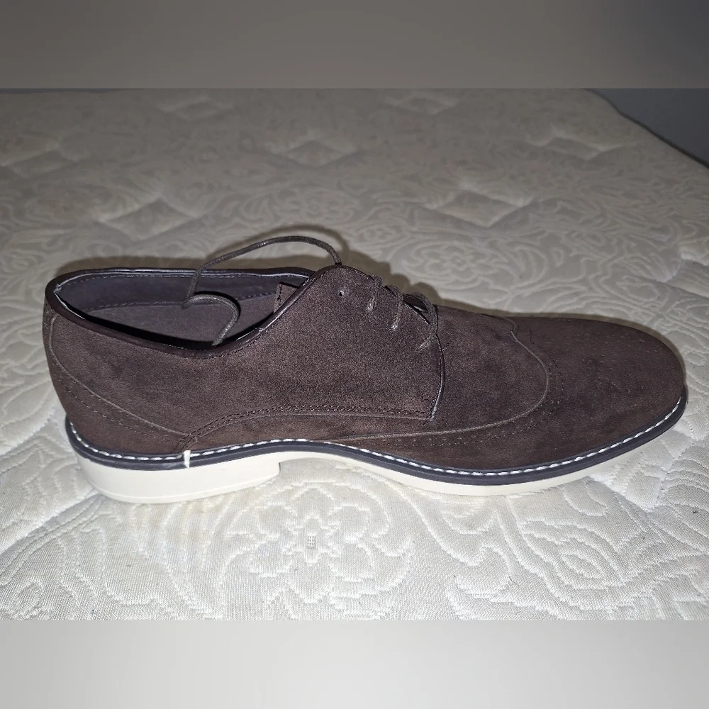 A pair of Franco Vanucci brown suede men's loafers in a size 10.5. EUC.
